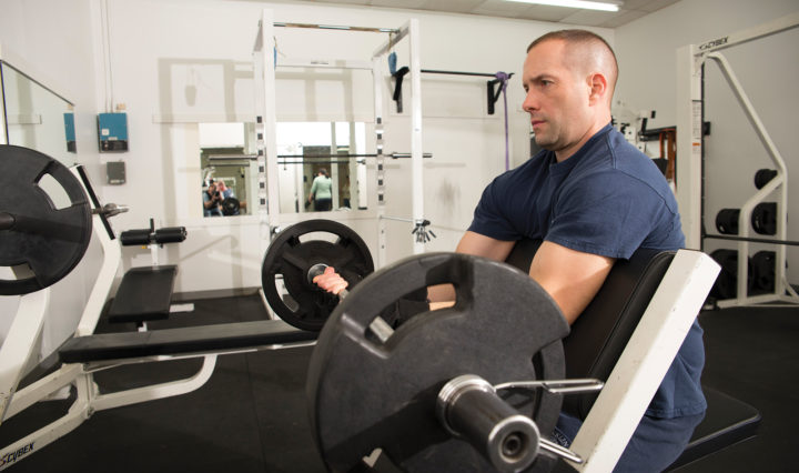 City employee working out in fitness center
