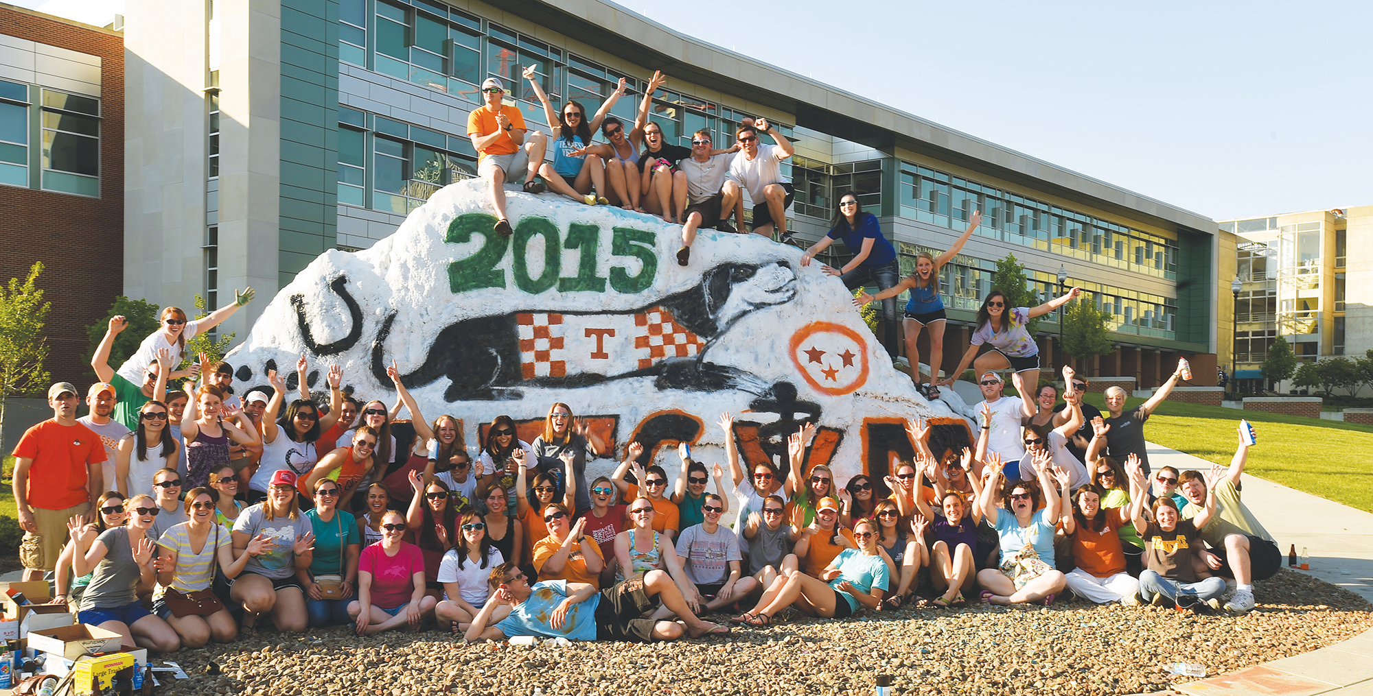CVM class of 2015 in front of The Rock, painted with Smokey, a horsehow and the state Tri-Star symbol