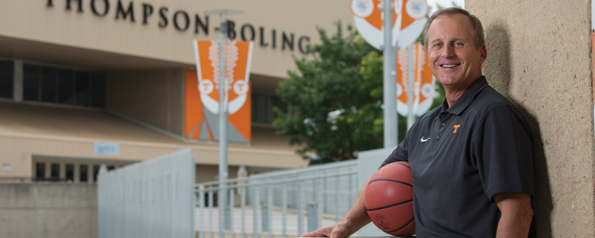 New Vols coach Rick Barnes outside of Thompson-Boling Arena with a basketball
