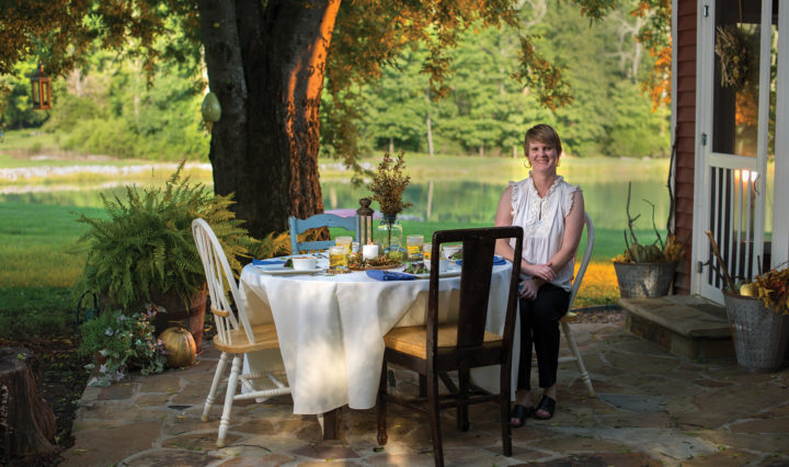 Elizabeth Davis seated at outdoor party table
