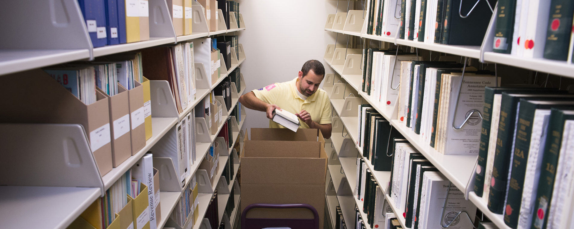 MTAS agent packing up files for office move