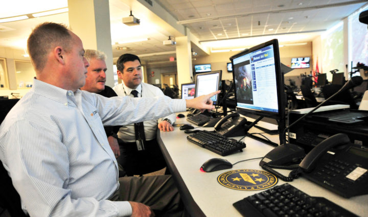Kevin Lauer (foreground) fire management consultant with CTAS, instructs Gary West, deputy commissioner, Tennessee Department of Commerce and Insurance, State Fire Marshal’s Office (left) and Patrick Sheehan (right) executive director for the Tennessee Emergency Management Agency.