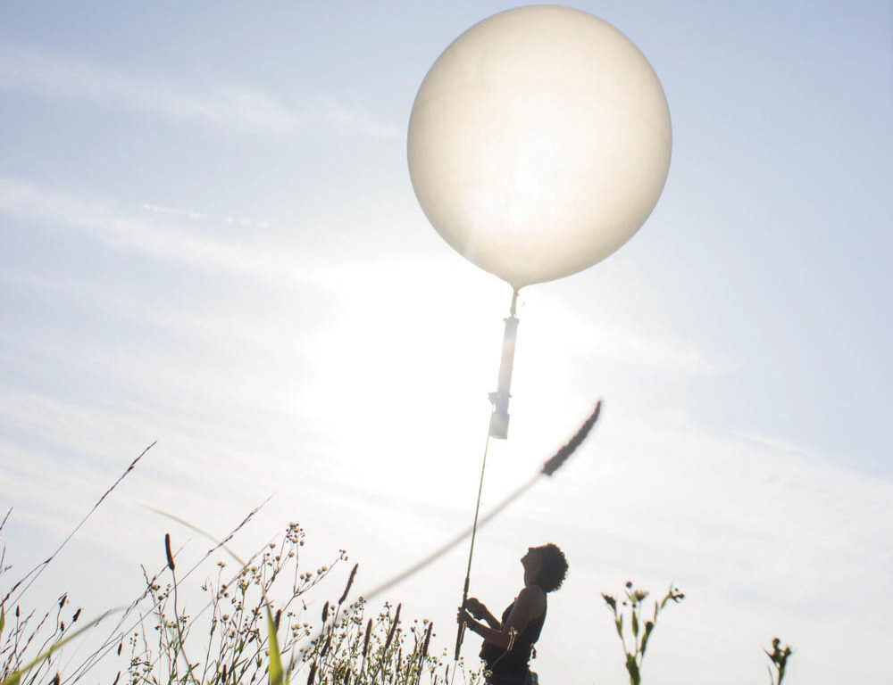 University of Tennessee Forestry, Wildlife and Fisheries student Emily Hockman launches a weather balloon equipped with an aerial acoustic recording system. The system was used to listen for the calls of at-risk avian species on DoD facilities.