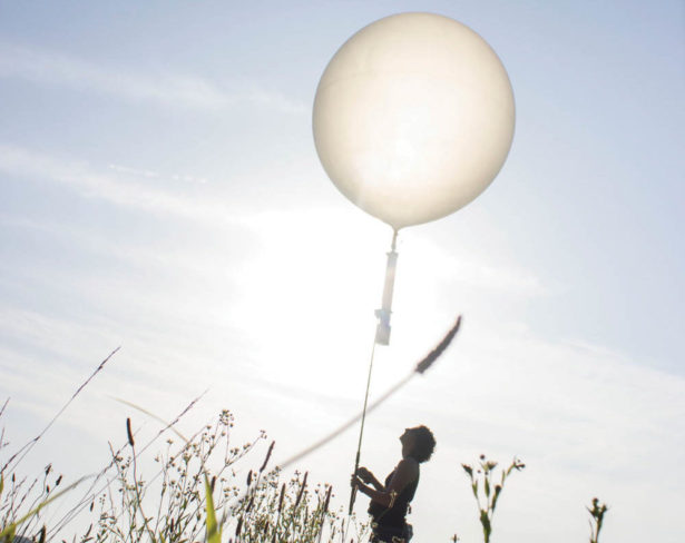 University of Tennessee Forestry, Wildlife and Fisheries student Emily Hockman launches a weather balloon equipped with an aerial acoustic recording system. The system was used to listen for the calls of at-risk avian species on DoD facilities.
