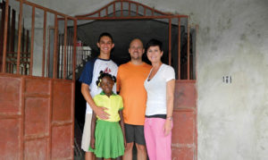 Harrison Kincaid, Onise, Stacy, and Sara Cox pose with one another in Haiti. (Photo courtesy of Stacy Cox)
