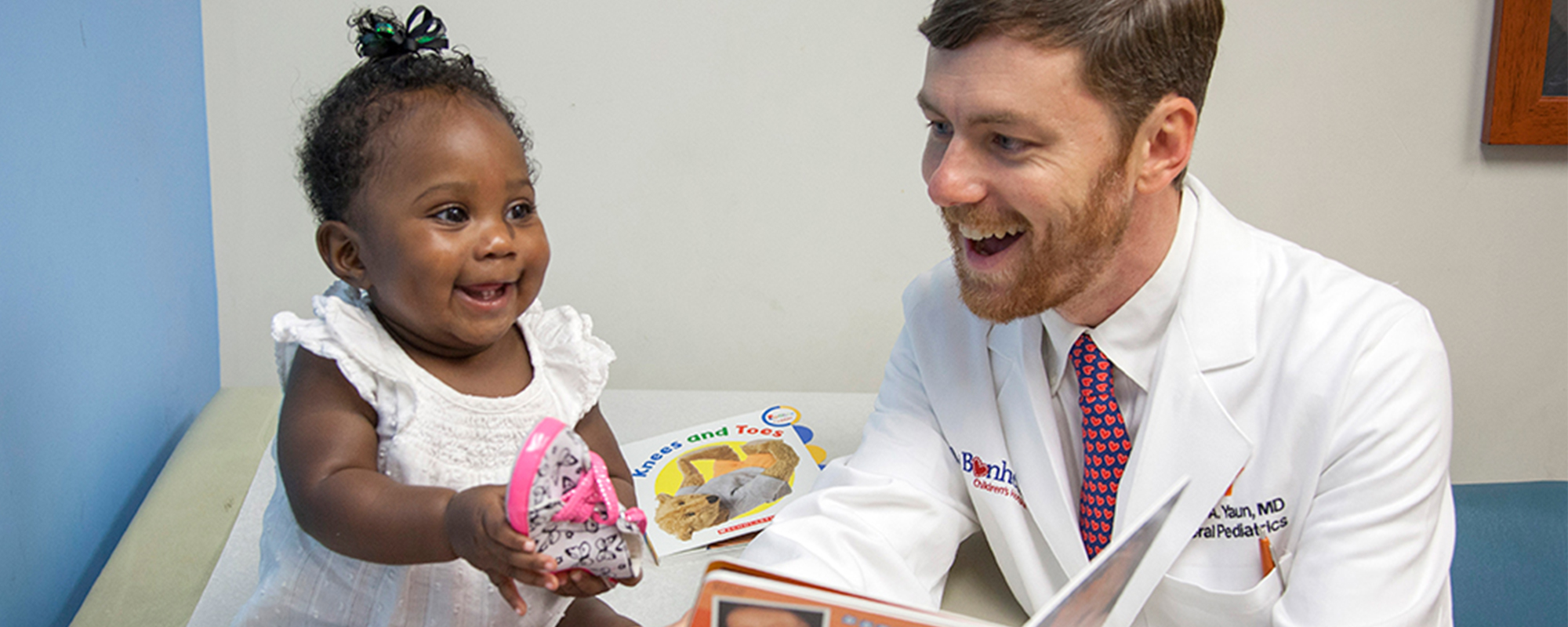 Dr. Jason Yaun meets with a patient, Dakota, at Le Bonheur Children's Hospital in Memphis.