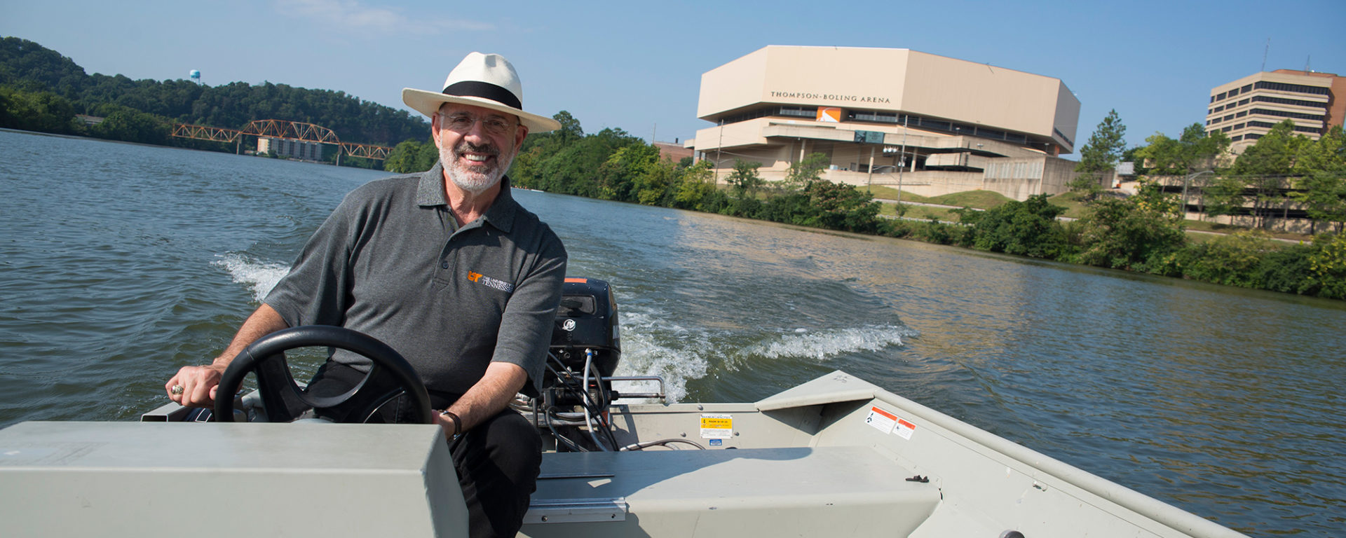 President Joe DiPietro explores the Tennessee River near campus on a boat courtesy of UT Rowing in Knoxville.