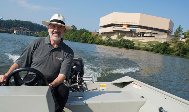 President Joe DiPietro explores the Tennessee River near campus on a boat courtesy of UT Rowing in Knoxville.