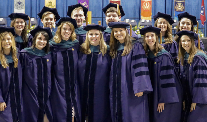 Participants in the first occupational therapy doctoral program gather after graduation.