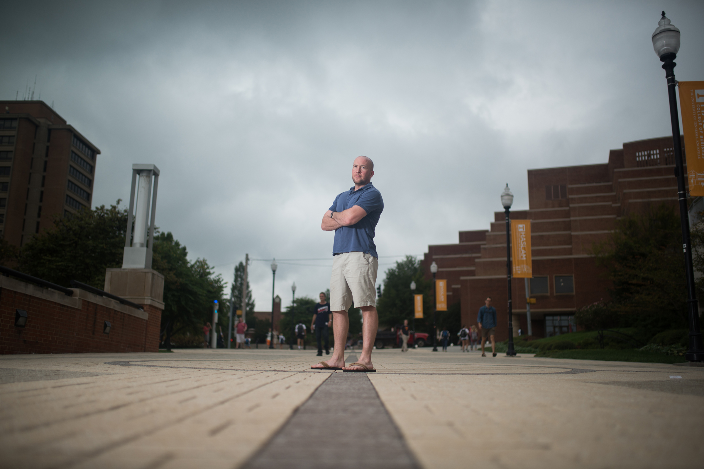 Jordan Harris stands in the center of the pedestrian walkway in front of Hodges Library in Knoxville