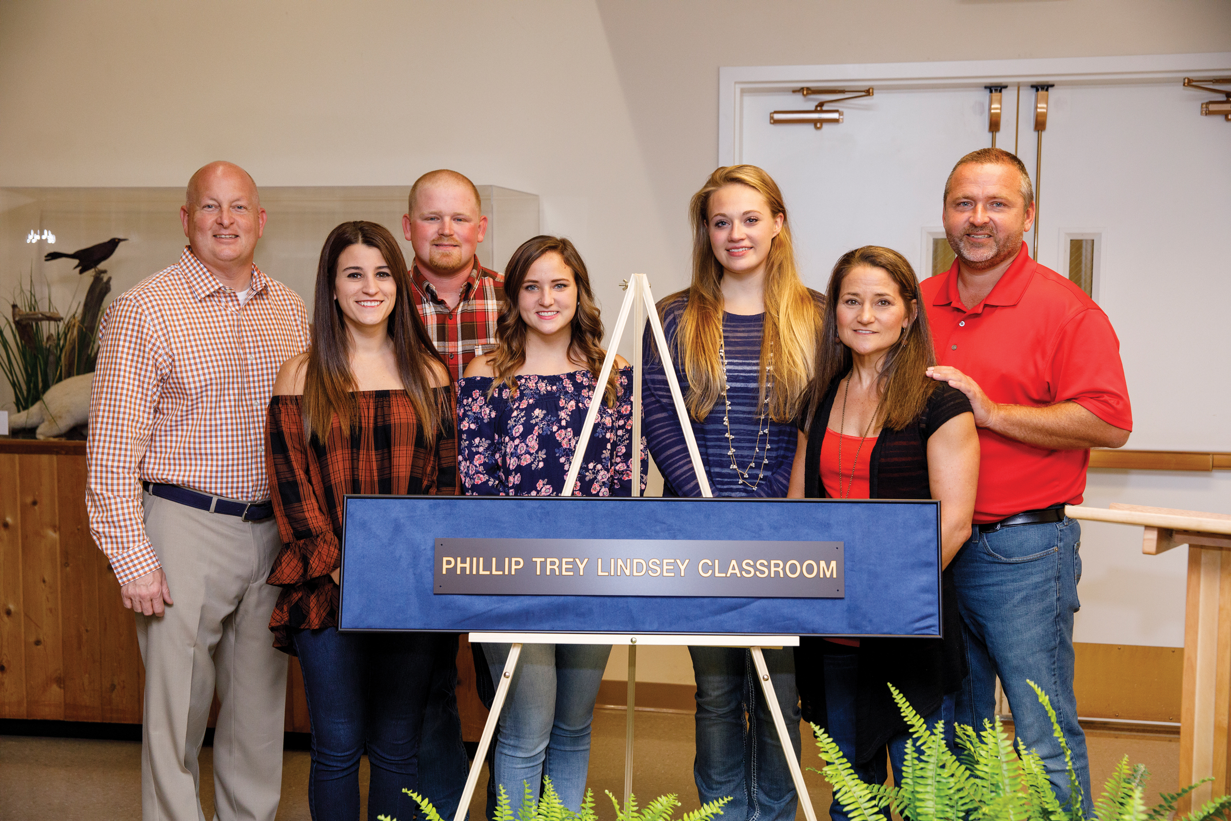 Keith Carver and the Lindsey family with the dedication plaque