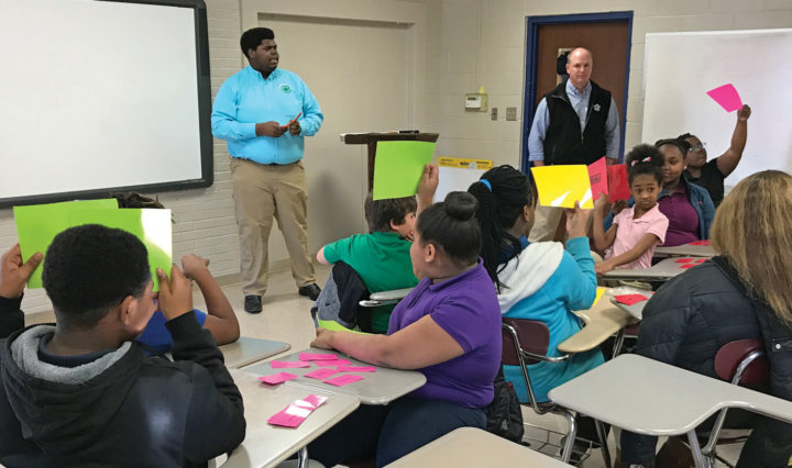 Left to right, UT Extension Agent Carrie Joyner, 4-H volunteer C.J. Bryson and Gibson County Sheriff Paul Thomas teach children about illegal and legal substances during Health Rocks. a 4-H program