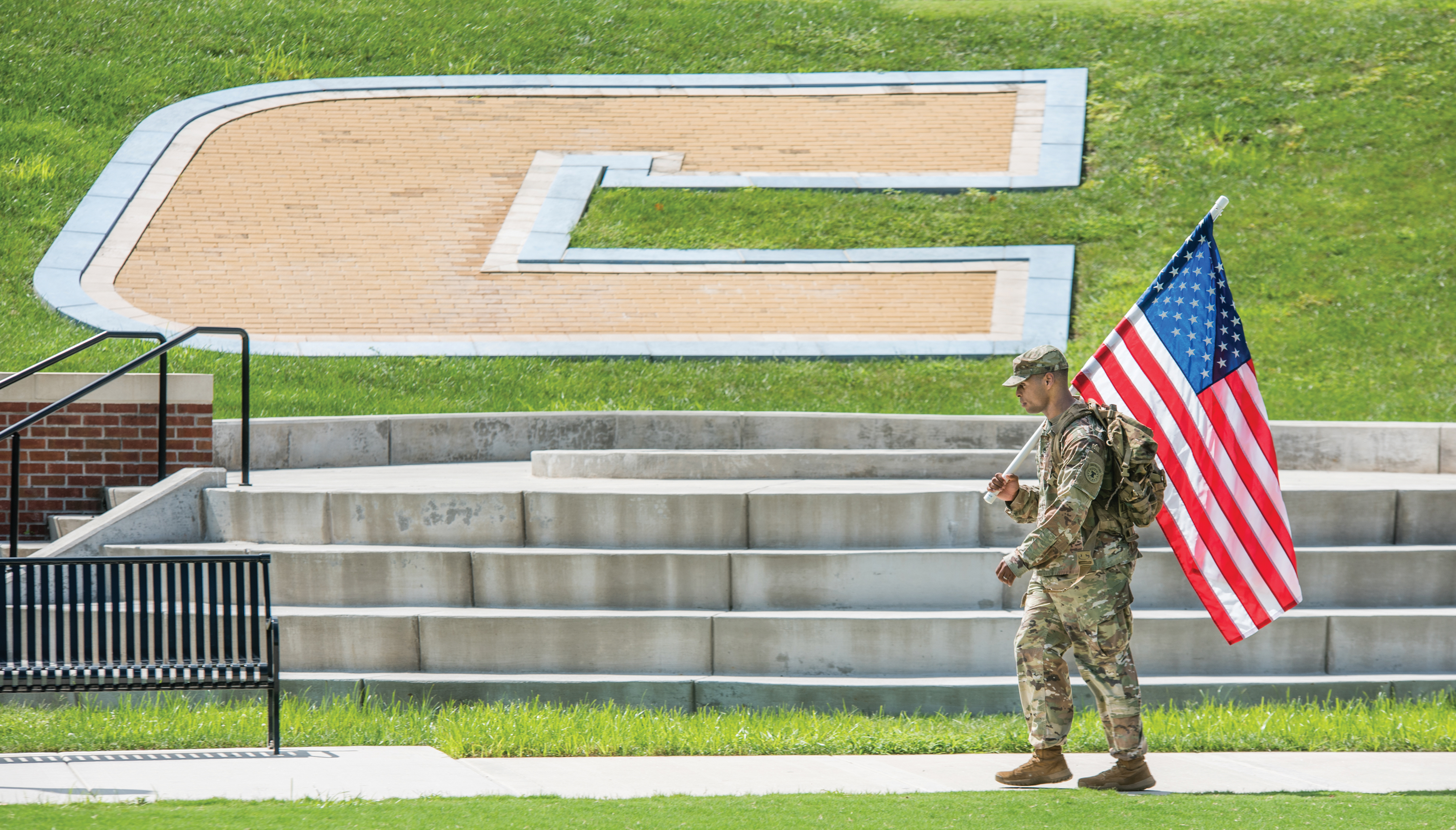 UT Chattanooga students and staff carry flags around Chamberlain Field in remembrance of 9/11.