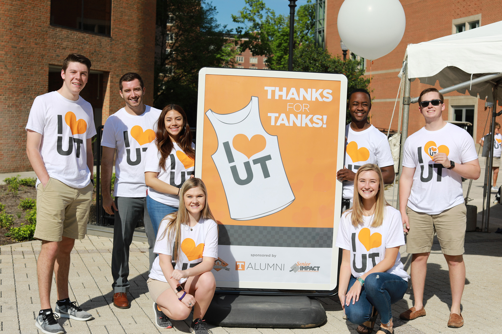 A group of students pictured waring "I Heart UT" shirts.