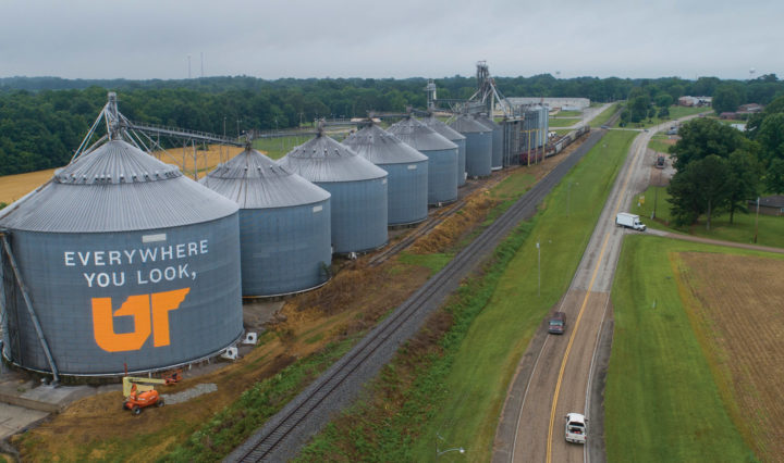 A row of grain silos in Sharon, TN. The largest and frontmost silo is painted with "Everywhere You Look, UT"