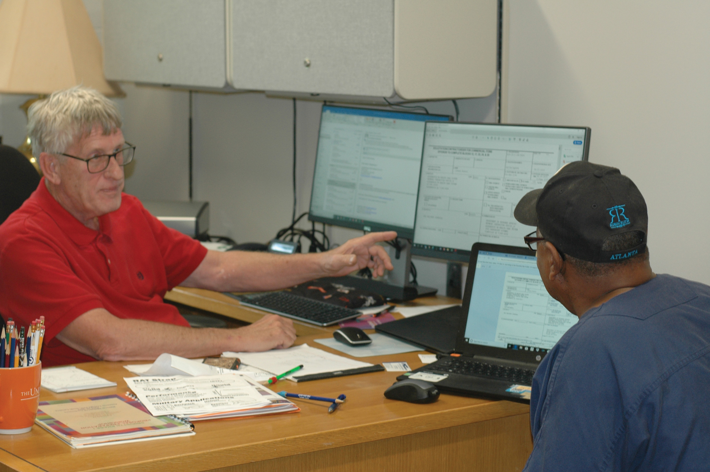 Russell Toone assists a business owner with the government contracting process.
