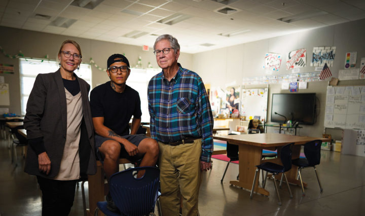 Karen Holst, Christoper Almanza, and Bob Kronick gather in a Pond Gap classroom