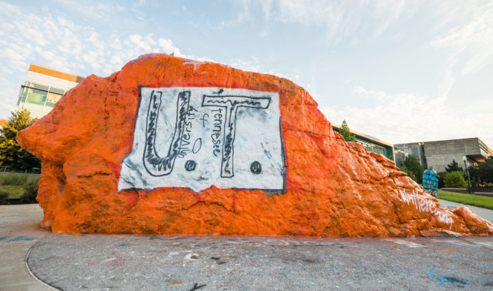 The Rock at UT painted orange with what looks like a white paper with a hand drawn UT design pinned to it