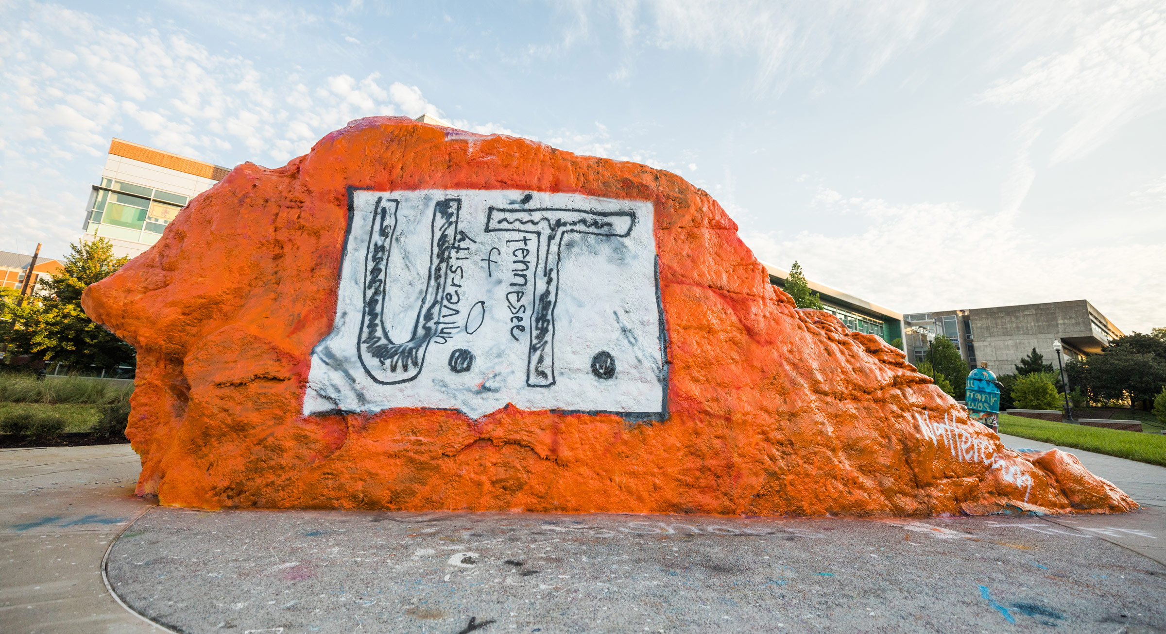 The Rock at UT painted orange with what looks like a white paper with a hand drawn UT design pinned to it