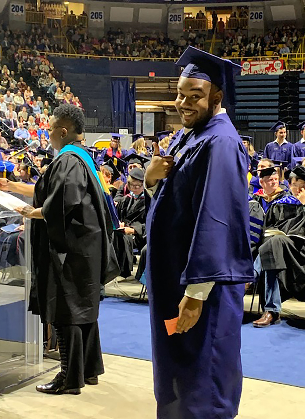 DeAndre Cole gives a thumbs up at the Winter 2019 commencement