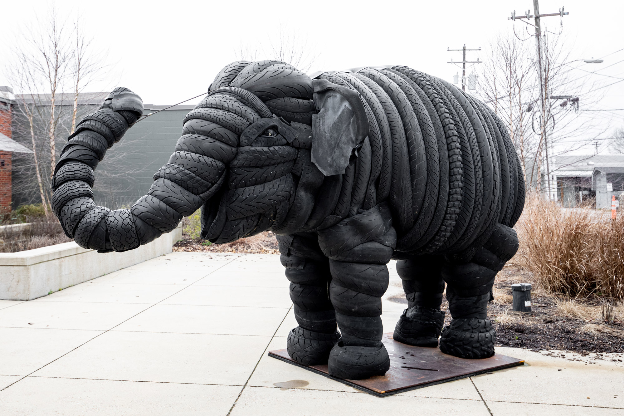 A sculpture of an elephant made of recycled used tires