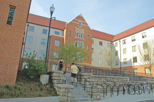 Two students walk up the steps leading to Robinson Hall