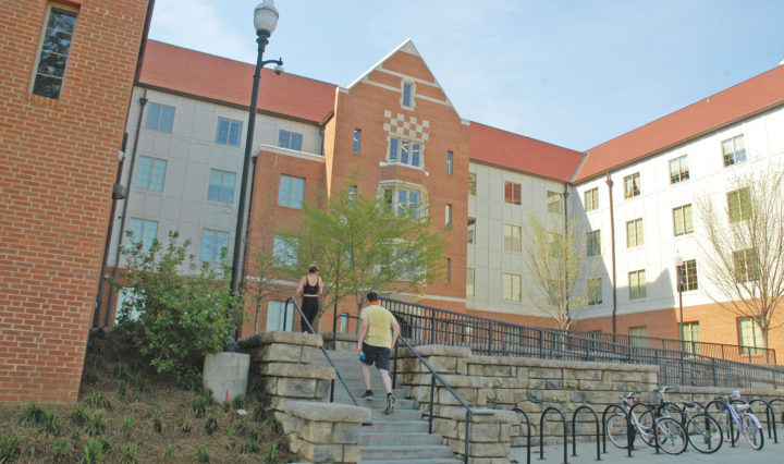 Two students walk up the steps leading to Robinson Hall