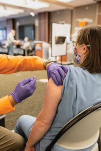 A patient recieves a Covid-19 vaccine