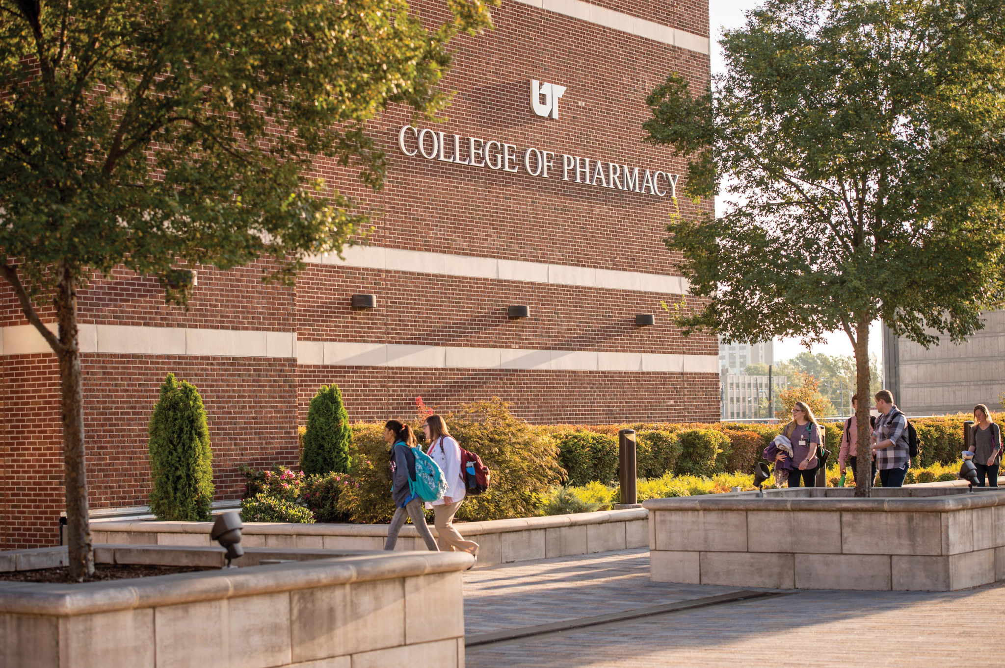 Two students walk by the College of Pharmacy building in Memphis, Tennessee