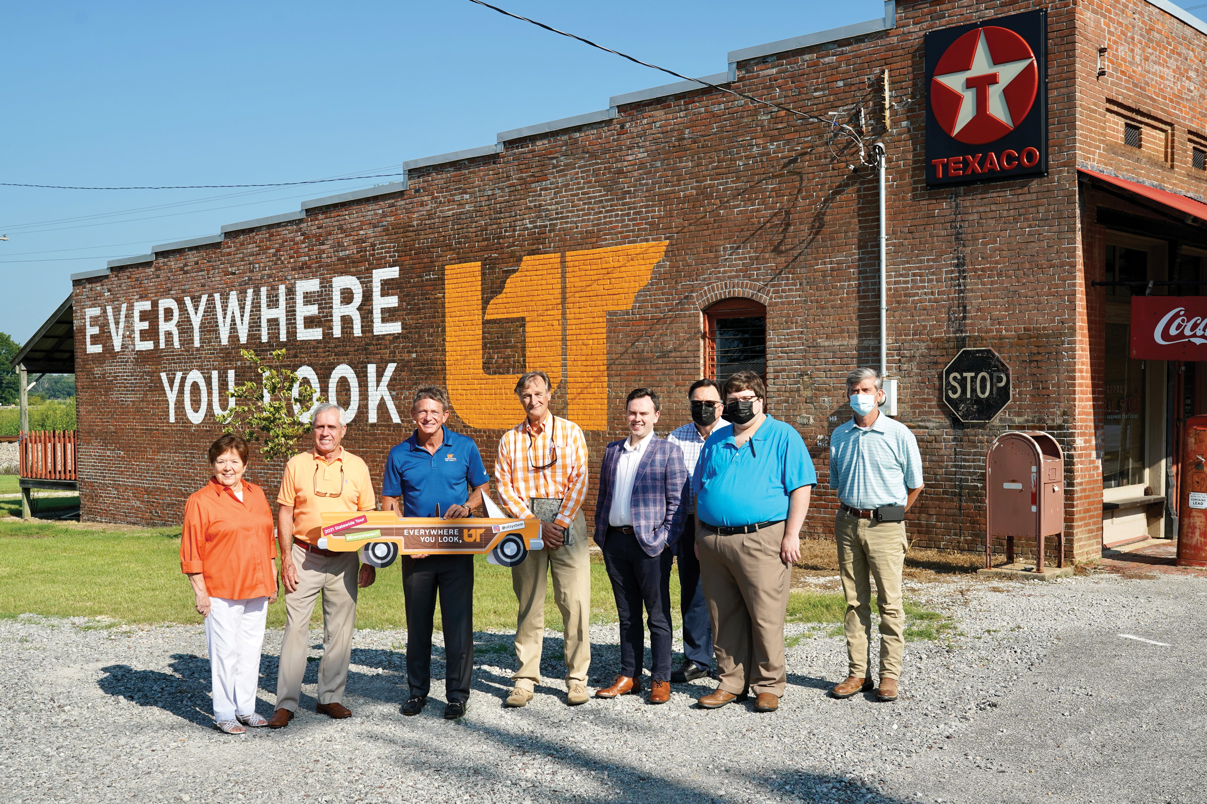 Randy Boyd and a group of locals in Fruitvale, Tennessee in front of the Everywhere You Look mural