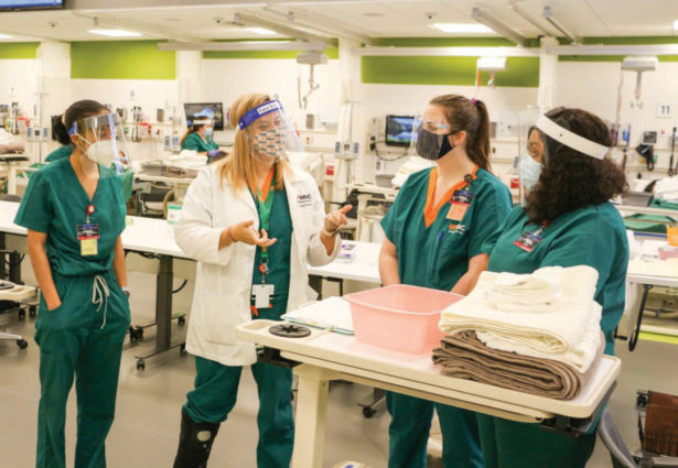 Three nurses are trained in a simulation lab