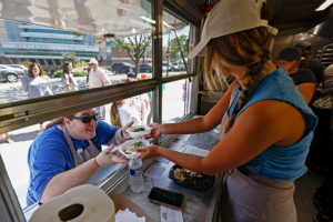 Students also take orders and serve the meals at the food truck.