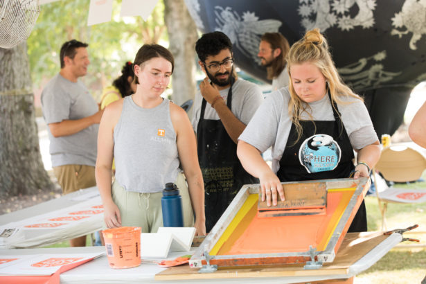 The UT Knoxville printmaking department makes special 225 prints at the Circle Park Block Party during the university's 225th birthday celebration. Photo by Steven Bridges.