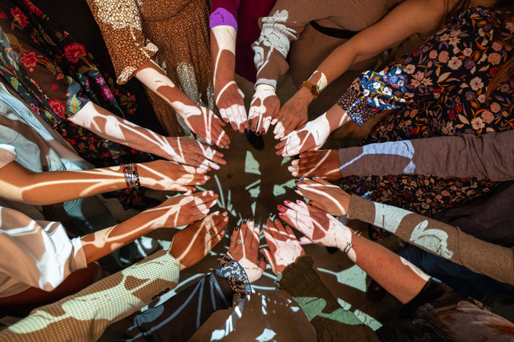 Midwife students' hands were blessed during a ceremony at UT Health Science Center. Photo by Caleb Jia