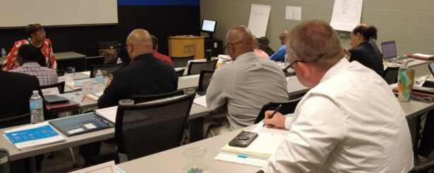 Attendees take notes during a classroom lecture at the Memphis Police Department Leadership Academy.