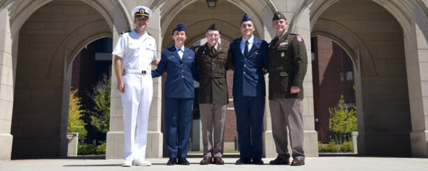 Navy Ensign Gage Smith, Air Force 2nd Lt. Jessica Smith, Army 2nd Lt. Lincoln Mitchell, Air Force 2nd Lt. Hayden Hall and Army Capt. Chase Morris stand for a photo.