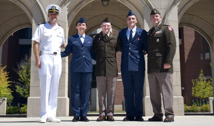 Navy Ensign Gage Smith, Air Force 2nd Lt. Jessica Smith, Army 2nd Lt. Lincoln Mitchell, Air Force 2nd Lt. Hayden Hall and Army Capt. Chase Morris stand for a photo.