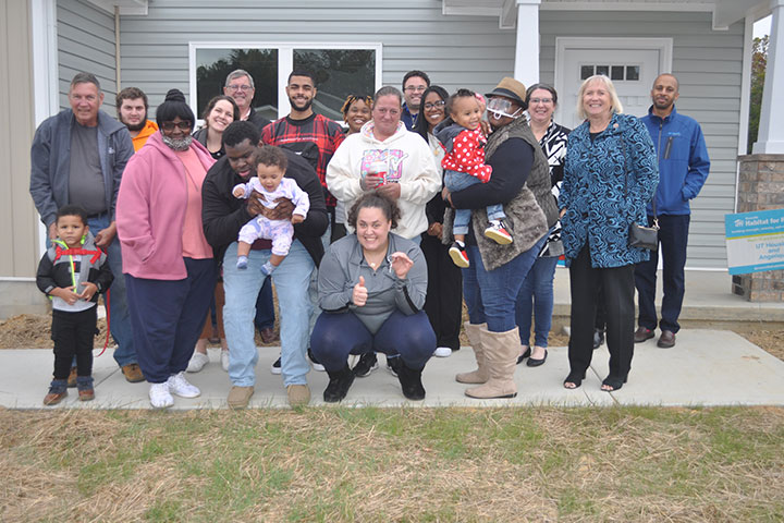 Angelique Carpenter, center, with friends and family who welcomed her to her new home.
