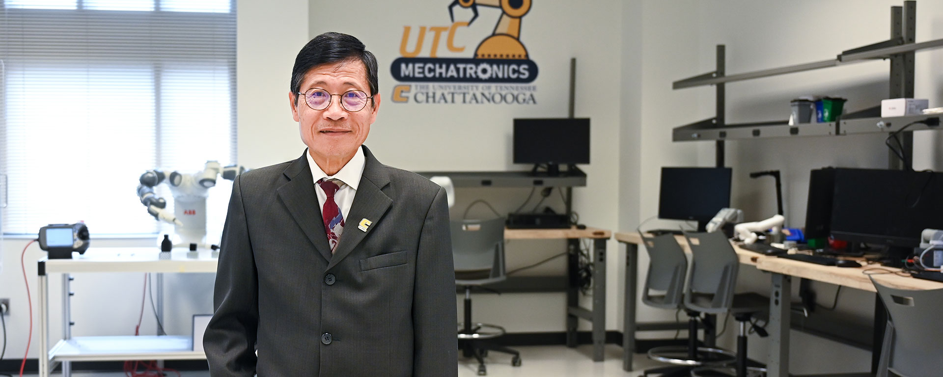 Cap Nguyen smiles for a photo inside one of UT Chattanooga's mechatronics labs.