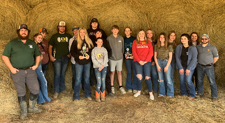 UT Extension agent Jason Brian Lawson, far left, poses with Hancock 4-H members at a county livestock judging contest.
