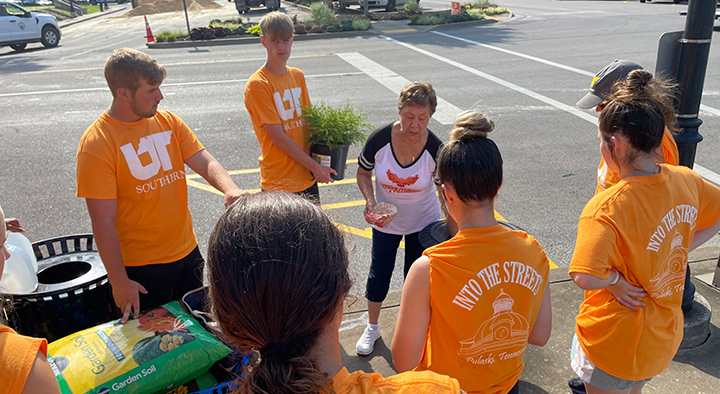 Clockwise from left, Bryson Gordon, George Grice, Ann Basinger with the Giles County Chamber of Commerce, Hannah Lindsey, Alivya Mahoney and Karla Tayebi work together on landscaping in downtown Pulaski.