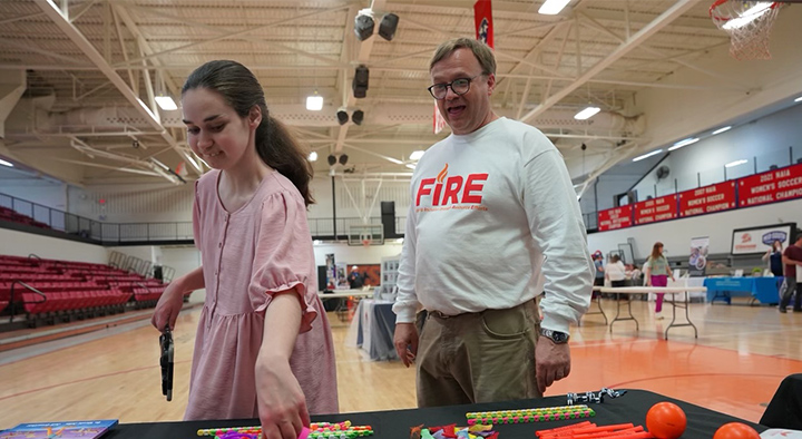 Alaina and Kevin Hood explore UT Southern's fair to help families with disabled children.