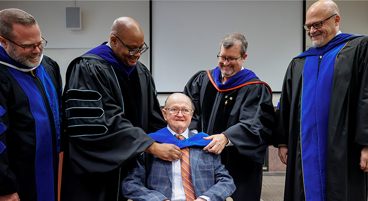 Rodney “Doc” Thomsen, who created the UT Martin agricultural business program, received an honorary doctorate of agricultural business degree. Pictured with Thomsen in the hooding ceremony are, from left, Joey Mehlhorn, agricultural economics professor and graduate studies dean; Yancy Freeman, UT Martin chancellor; Todd Winters, College of Agriculture and Applied Sciences dean; and Philip Acree Cavalier, provost and senior vice chancellor for academic affairs.