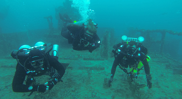 UTHSC Chair of the Department of Emergency Medicine Richard Walker explores a sunken ship during a scuba dive.