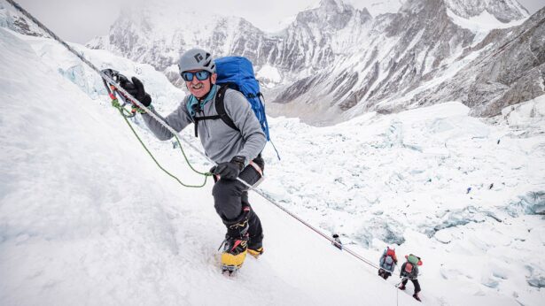 Lonnie Bedwell ascends the Khumbu Icefall with the help of a fixed line on his way to Camp I.