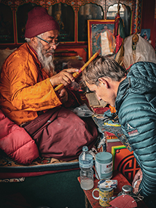 Bryan Hill receives a blessing from the lama in the Pangboche Monastery.