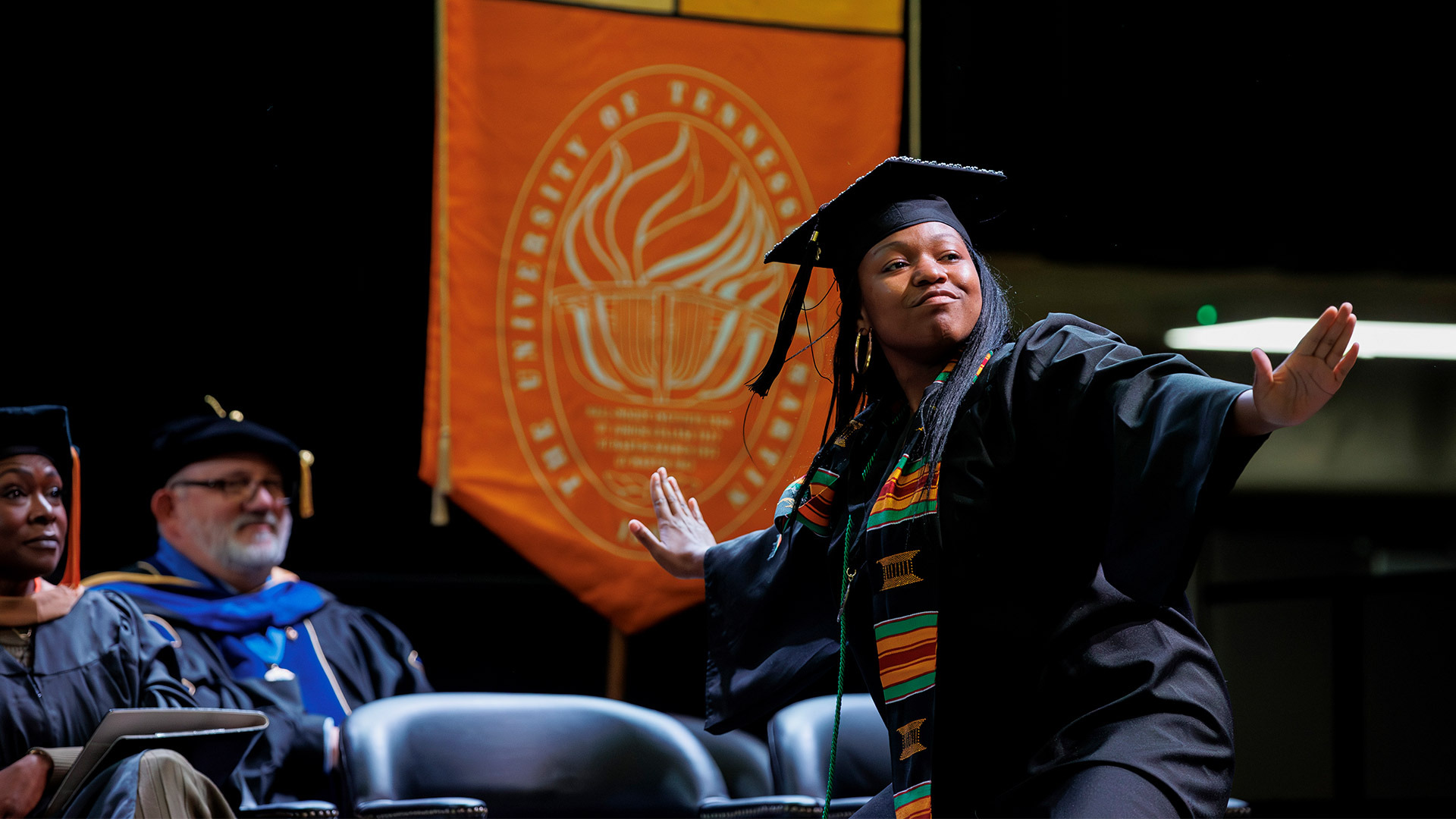 M’dia Walker dances as she crosses the commencement stage at UT Martin.