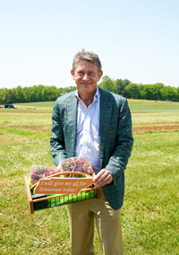 UT System President Randy Boyd showcases strawberries grown at an agricultural research and education center.