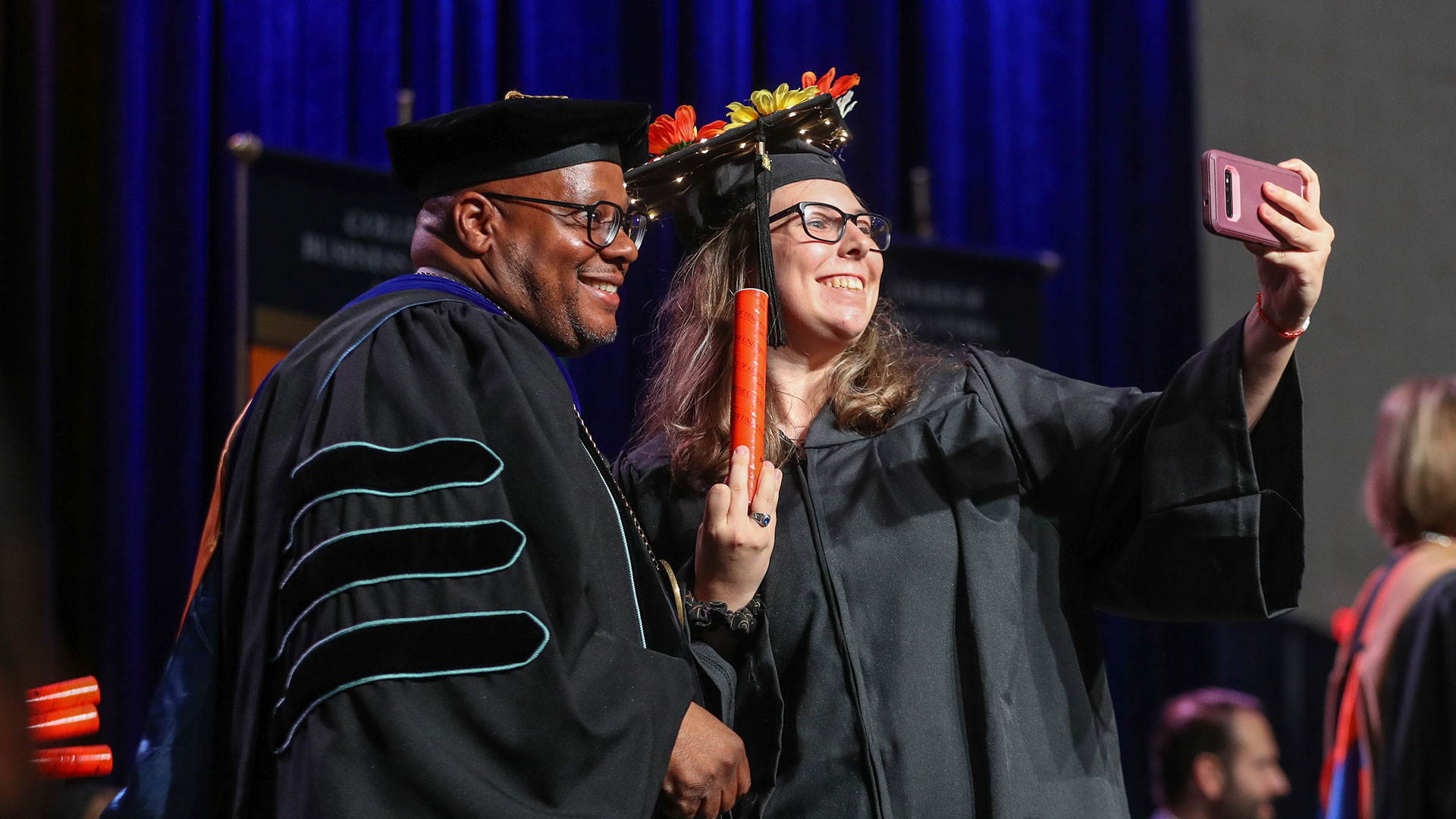UT Martin Chancellor Yancy Freeman pauses for a selfie with Jaycee Campbell during the spring 2024 ceremony.