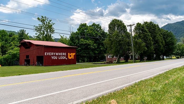 A road-side, red barn with the words "Everywhere You Look, UT" painted on it.